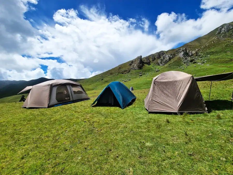 Luxury eco-friendly Inca Trail premium campsites with sleeping tents and a dining tent at the Andean mountains.