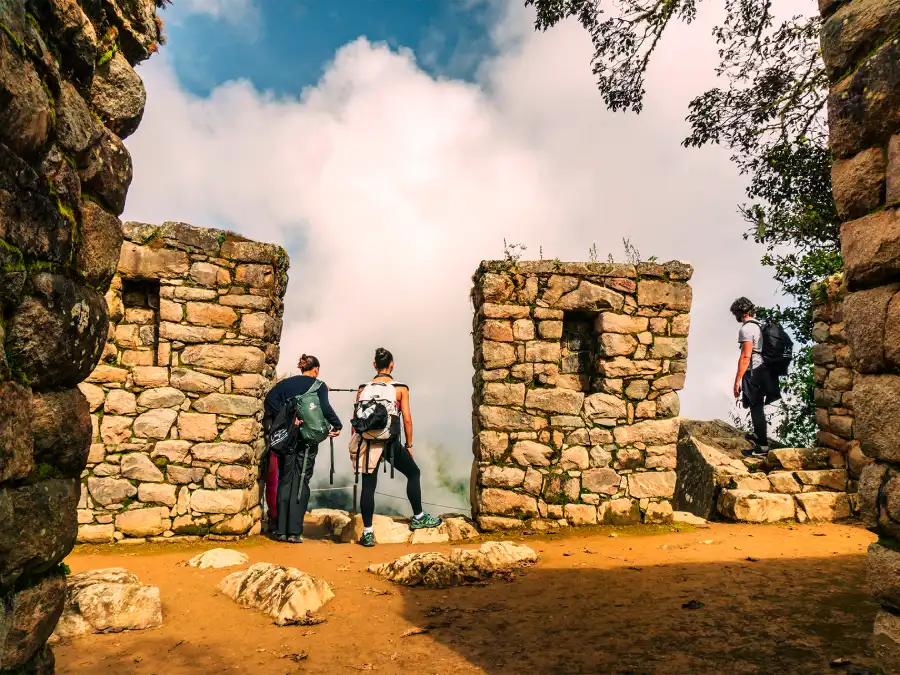 Family enjoying a scenic moment on the Luxury Inca Trail for Families with panoramic views of the Andes.