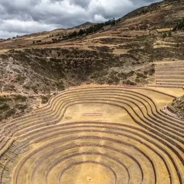 Ancient circular agricultural terraces surrounded by the Andean highlands.