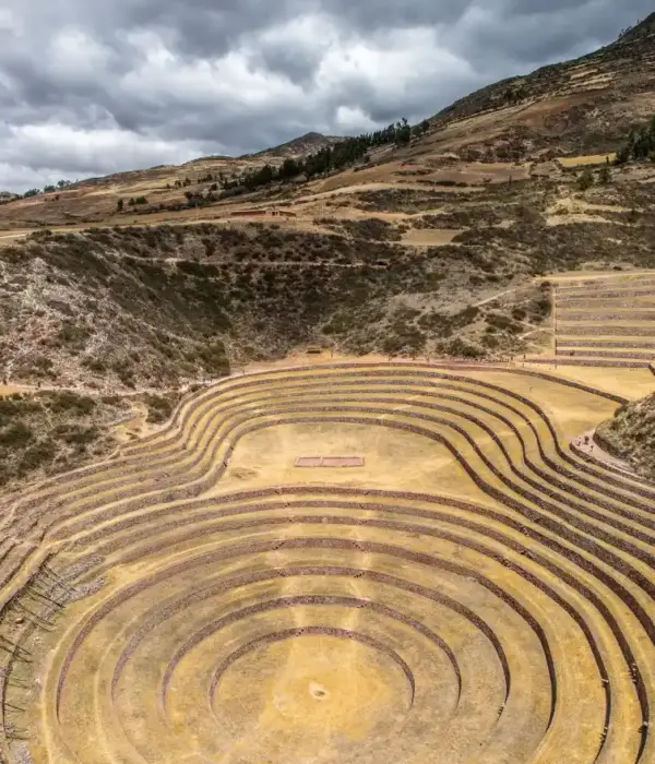Ancient circular agricultural terraces surrounded by the Andean highlands.
