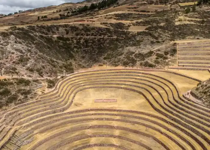 Ancient circular agricultural terraces surrounded by the Andean highlands.